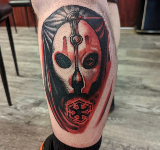 Explore blue flame tattoo ideas, creative tattoo ideas in Clinton, available at Black Relic Tattoo