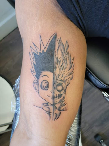 Explore man face tattoo ideas, creative tattoo ideas in Warrensburg, available at Altered Visions Tattoo Studio