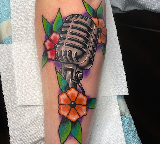 Explore inner bicep tattoo ideas for men, creative tattoo ideas in Athens, available at Pain and Wonder Tattoo and Piercing Studio