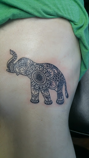 Explore rose tattoo ideas for men, creative tattoo ideas in Reno, available at Evolution Tattoo