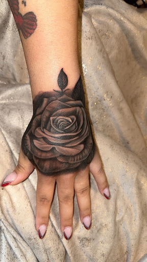 Explore cover up tattoo ideas for lower back, creative tattoo ideas in Norman, available at Out of line tattoo