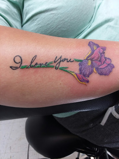 Find tattoo under breast ideas for your next unique tattoo in Salem at Outwest Tattoo and body piercing ,30 years of tattooing,only life time guarantee