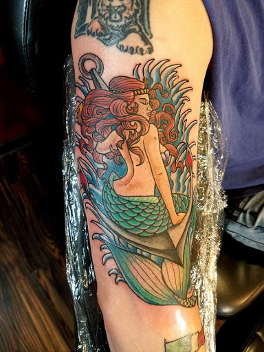 Explore dirt bike tattoo ideas, creative tattoo ideas in Huntsville, available at Blacktide Tattoo Co.