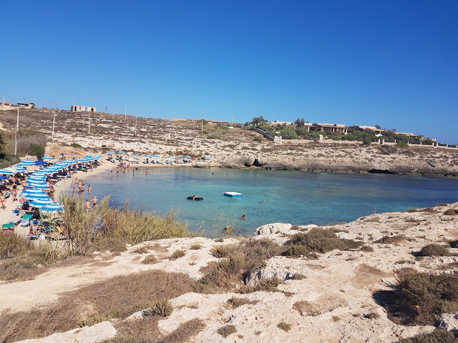 Photo of Cala Francese with turquoise pure water surface