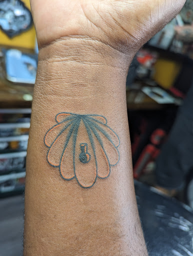 Explore smiley face tattoo ideas, creative tattoo ideas in Bradenton, available at Classic Ink Tattoo Studio