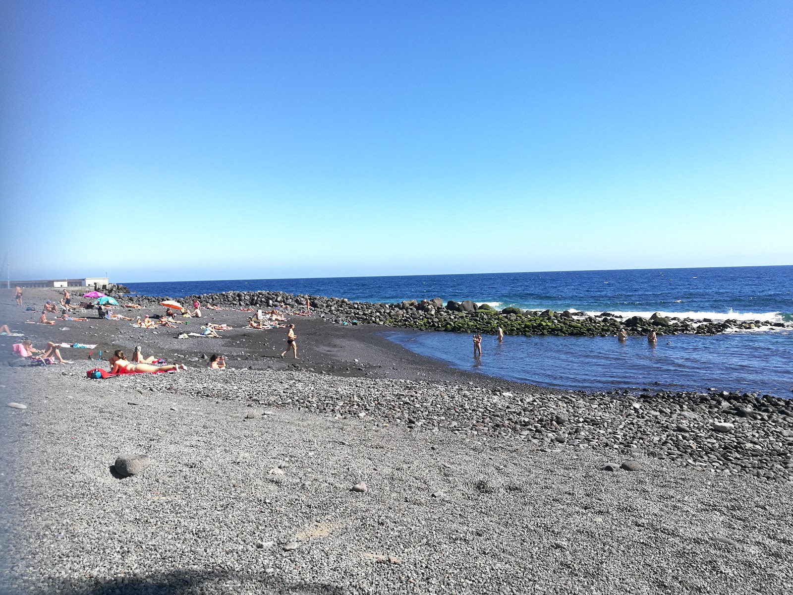 Photo de Playa de Olegario avec l'eau cristalline de surface