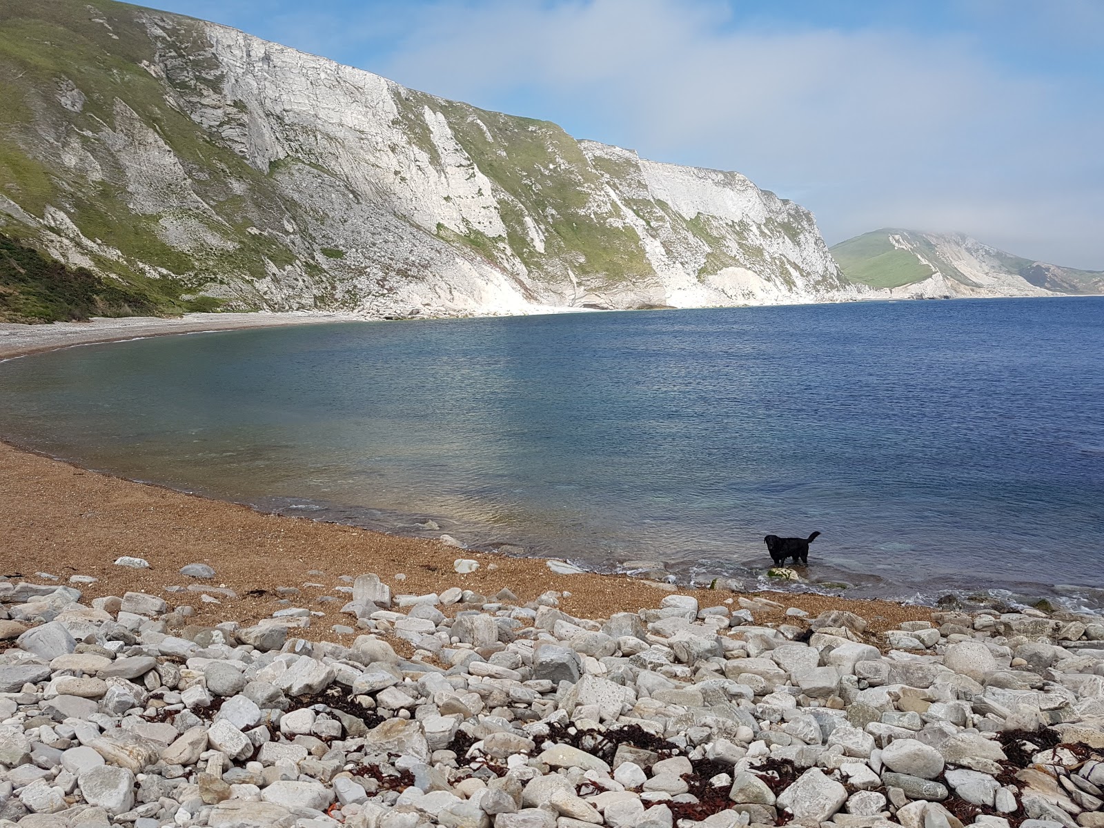 Foto af Mupe Bay beach med blåt rent vand overflade