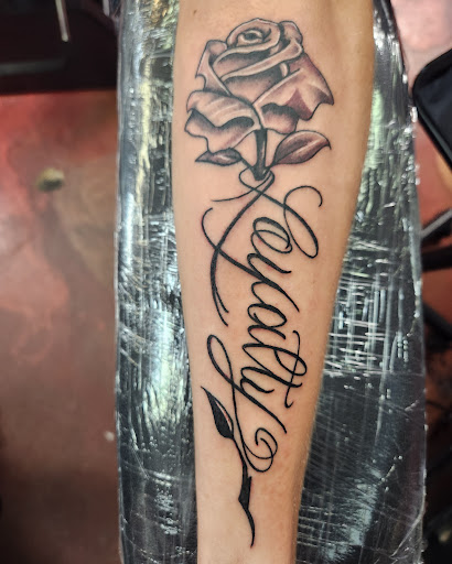 Explore tattoo ideas with your child's name, creative tattoo ideas in Inverness, available at The Perfect Spot Tattoos