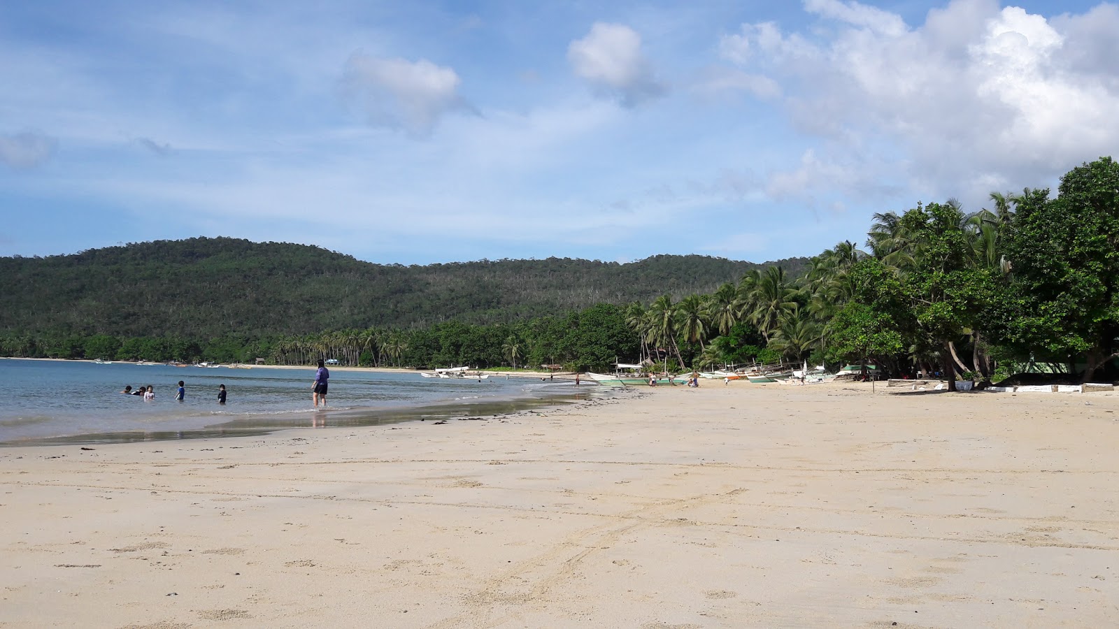Foto di Tagcawayan Beach con una superficie del sabbia fine e luminosa