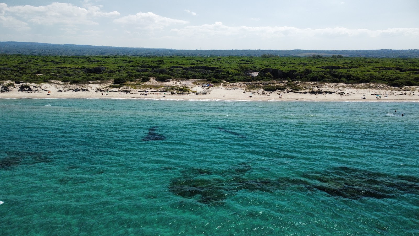 Foto di Bau Bau Beach con una superficie del acqua cristallina