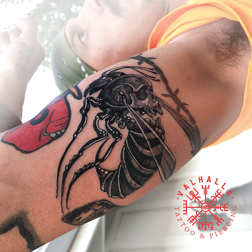 Explore back tattoo ideas male, creative tattoo ideas in Rogers, available at Valhalla Tattoo & Piercing Studio