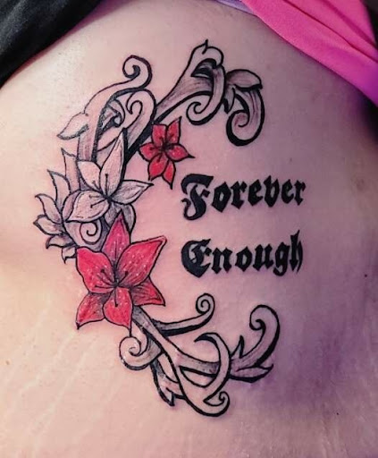 Explore cover up lower back tattoo ideas, creative tattoo ideas in Somerset, available at JUJU