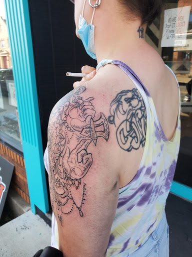 Explore cross sleeve tattoo ideas, creative tattoo ideas in Buffalo, available at Madd Ink Tattoo & Piercing