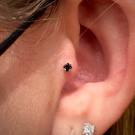 Explore tattoo ideas behind the ear tattoos, creative tattoo ideas in Clawson, available at Green Light Body Piercing