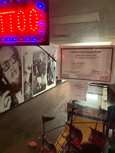 Explore upper arm cover up tattoo ideas, creative tattoo ideas in Seymour, available at American Gypsy Tattoo Corp.