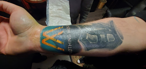 Explore mother and son matching tattoos ideas, creative tattoo ideas in Monroe, available at Vivid Art Tattoos