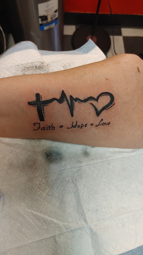 Explore tomahawk tattoo ideas, creative tattoo ideas in Newport, available at T N T Explosive Tattoo