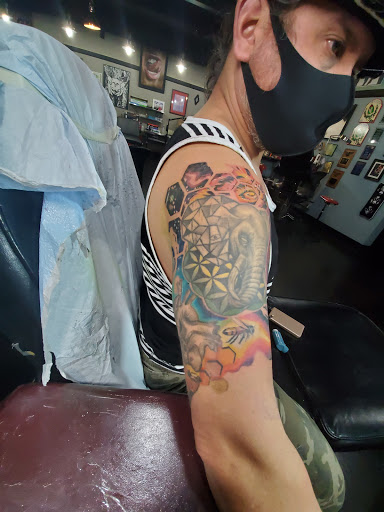 Explore large flower tattoo ideas, creative tattoo ideas in Auburn, available at Action Tattoo
