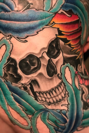 Find book of tattoo ideas for your next unique tattoo in Peoria at Iron Key Tattoo Studio Inc.