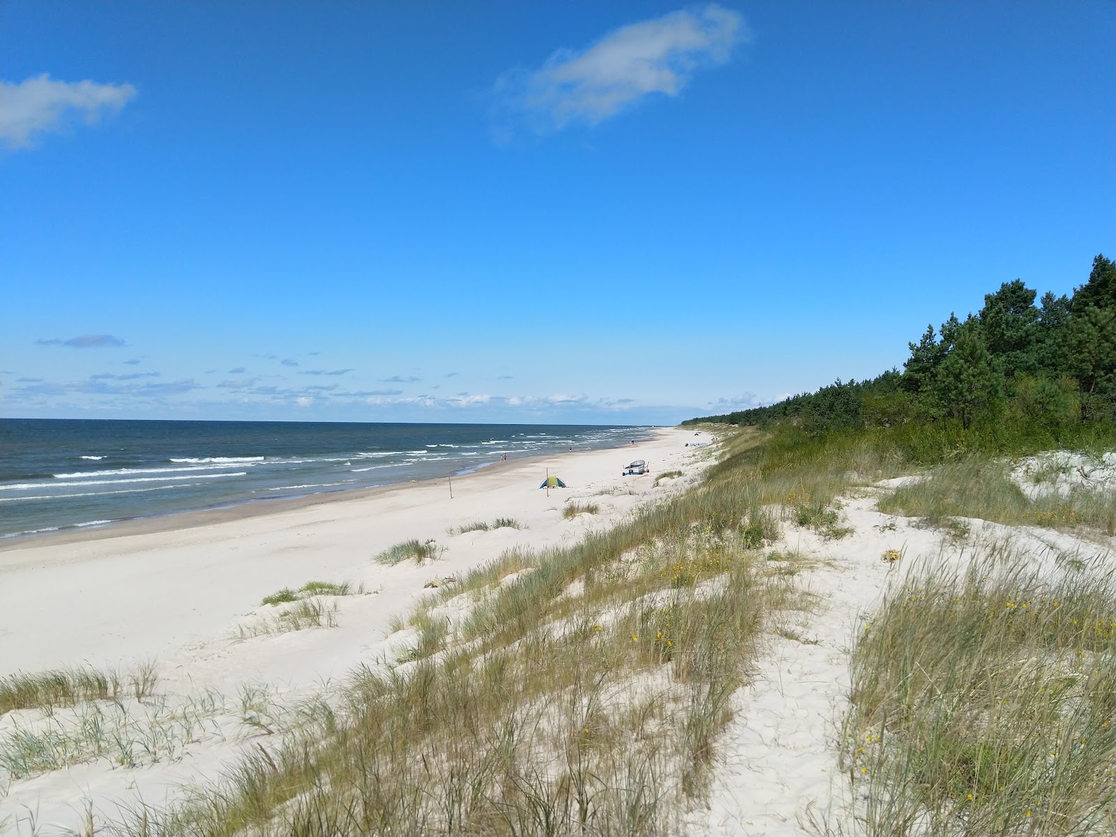 Photo of Nemirsetos nudistu pliazas with bright sand surface