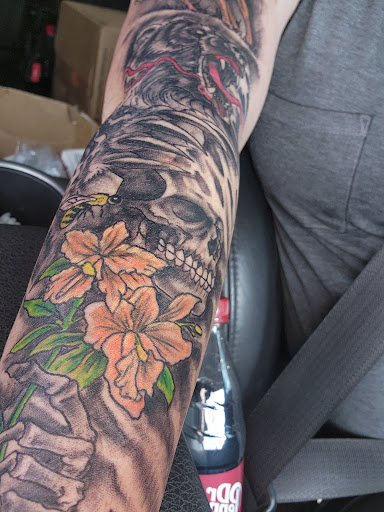 Explore fist bump tattoo ideas, creative tattoo ideas in Edmond, available at The Tattoo Shop Edmond