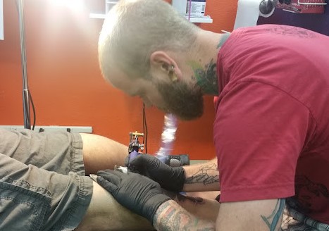 Explore mens neck tattoo ideas, creative tattoo ideas in Sparks, available at Under Your Skin Tattoo & Body Piercing