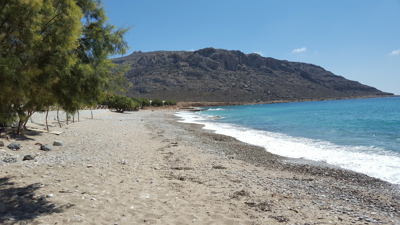 Photo of Paralia Goudouras with light sand &  pebble surface