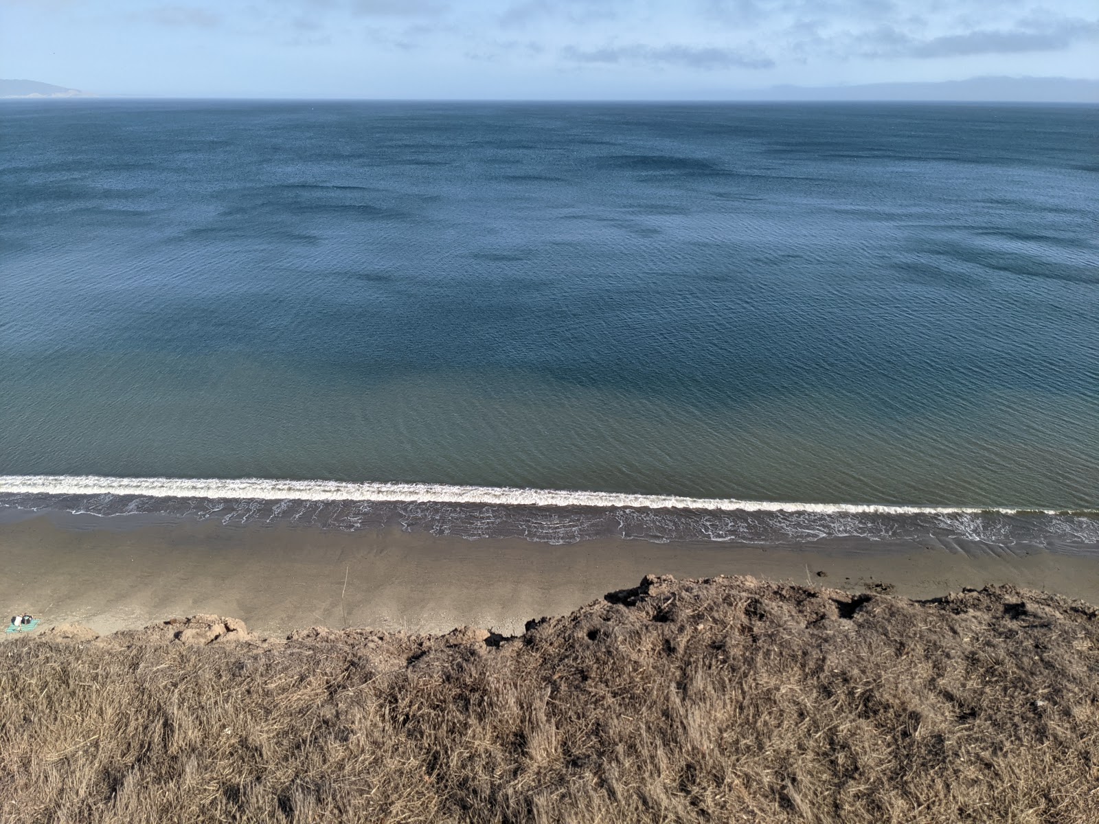 Foto av Drake beach - populär plats bland avkopplingskännare