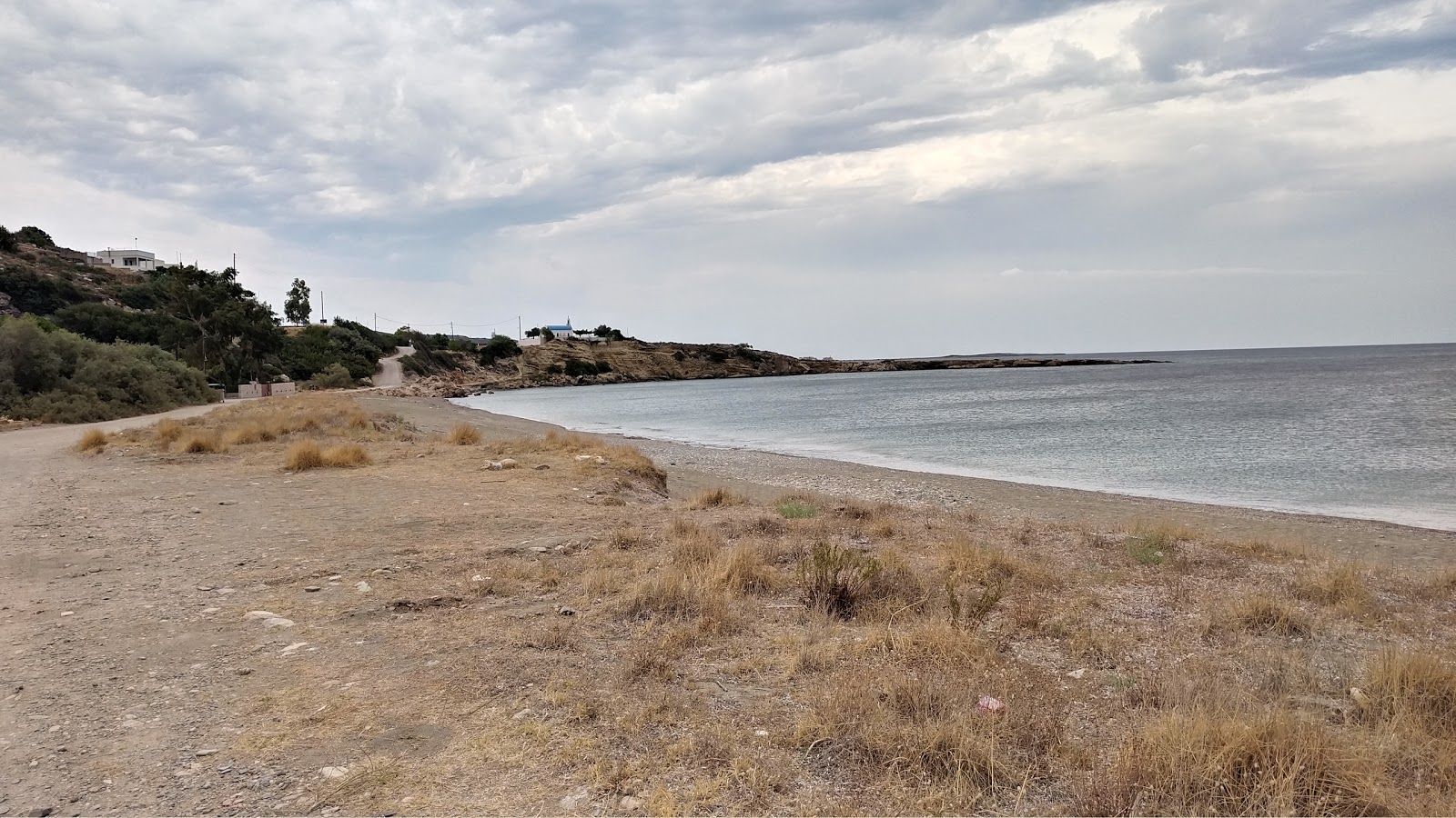 Foto de Harakia beach con arena beige superficie