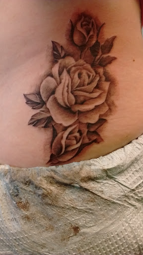 Explore jawline tattoo ideas, creative tattoo ideas in Decatur, available at Exclusive Ink Tattoos & Body Piercings 22nd & Wood