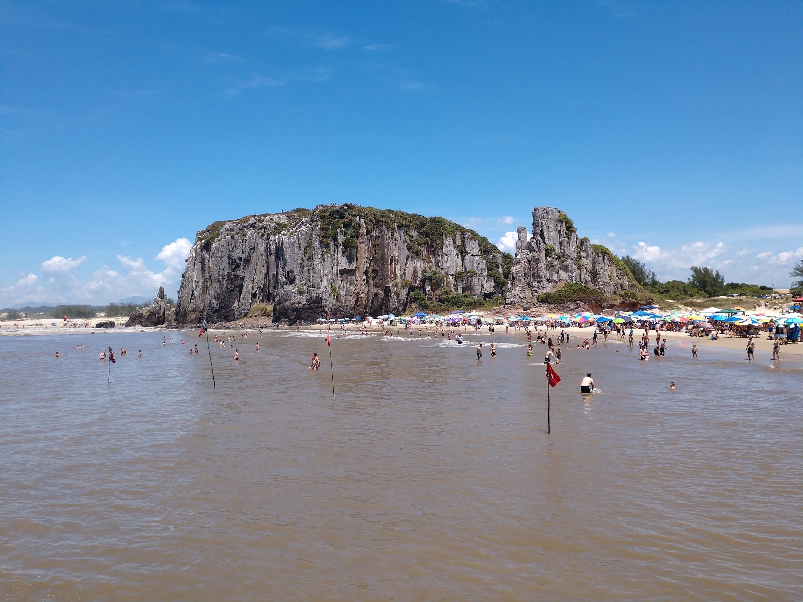 Photo of Guarita Beach backed by cliffs