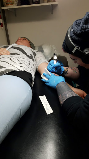 Explore open book tattoo ideas, creative tattoo ideas in New Bern, available at Firehouse Tattoo.