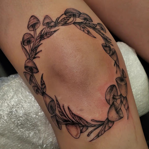 Explore feminine cross tattoo ideas, creative tattoo ideas in Palm Harbor, available at Angry Owl Tattoo and Piercing