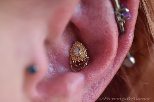 Explore bourbon glass tattoo idea, creative tattoo ideas in Grand Junction, available at Earthbound Body Piercing