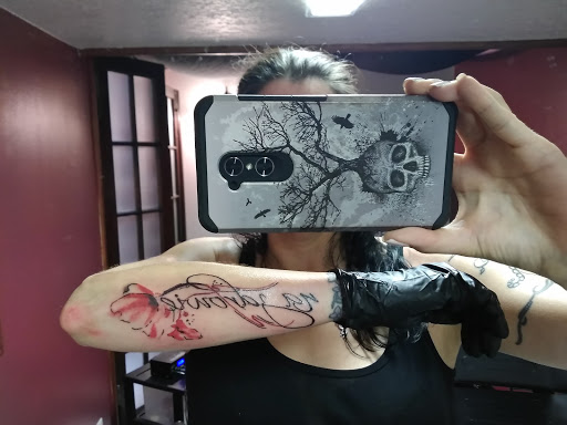 Explore feminine cross tattoo ideas, creative tattoo ideas in Arcade, available at 98 South Tattoo and Piercing