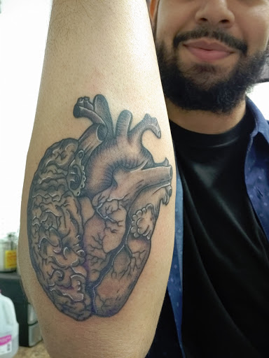 Explore sign language tattoo ideas, creative tattoo ideas in Sioux Falls, available at Outlaw Tattoos