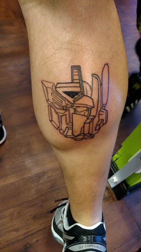 Explore arm florida tattoo ideas, creative tattoo ideas in Wilmington, available at The Gay Penguin Piercing and Tattoo in Wilmington Nc