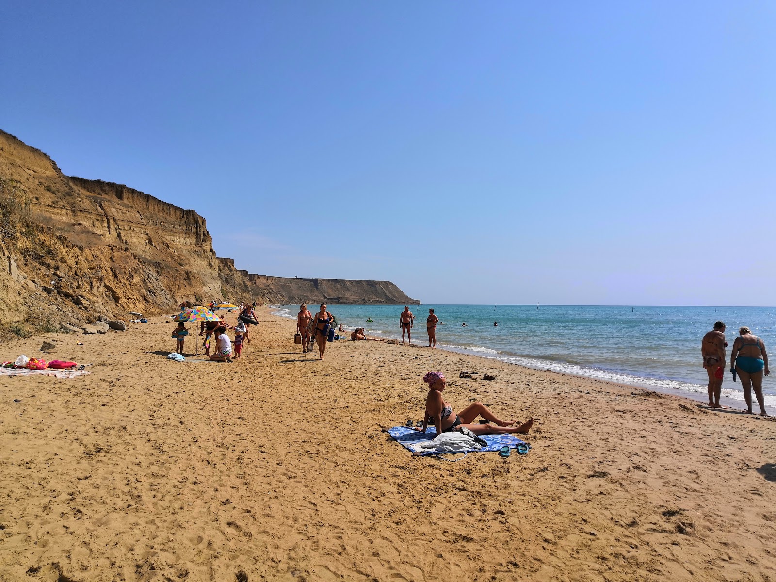 Fotografija Plyazh Volna z svetel pesek površino
