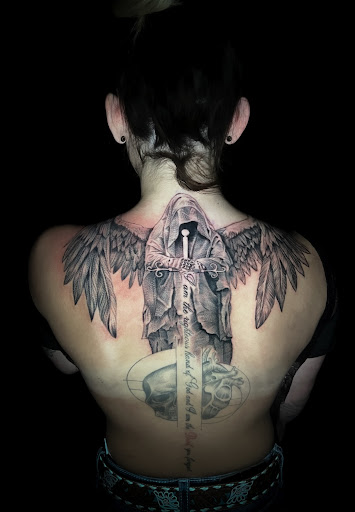 Explore cover up tattoo ideas for lower back, creative tattoo ideas in Silver City, available at Independent Ink Tattoo