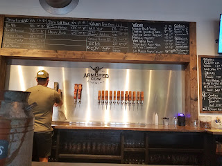 Beer taps lined up on a bar