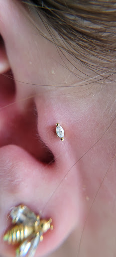 Explore simple one piece tattoo ideas, creative tattoo ideas in Buffalo, available at Moria Piercing and Jewelry