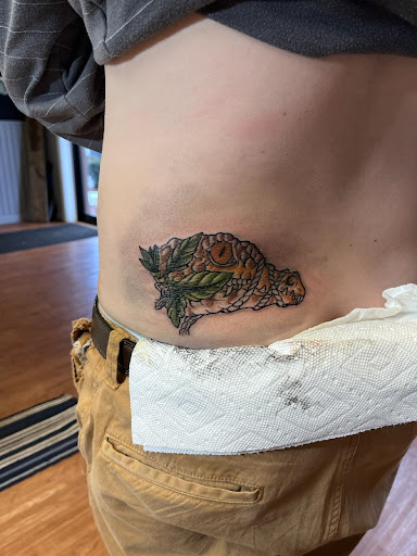 Explore lotus flower tattoo ideas, creative tattoo ideas in Williamston, available at Inkd Tattoo Parlor