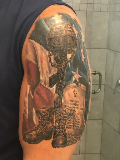 Explore tricep tattoo ideas for men, creative tattoo ideas in Myrtle Beach, available at Elite Ink Tattoos of Myrtle Beach