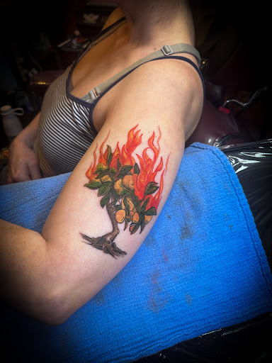 Explore sun tattoo ideas for men, creative tattoo ideas in Moweaqua, available at Fleshwound Tattoo