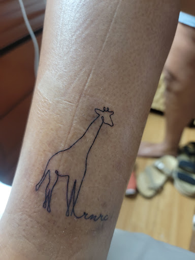 Tattoo Shop «Confessions of the Hand tattoo art gallery», reviews and photos, 2100 E Osceola Pkwy, Kissimmee, FL 34743, USA