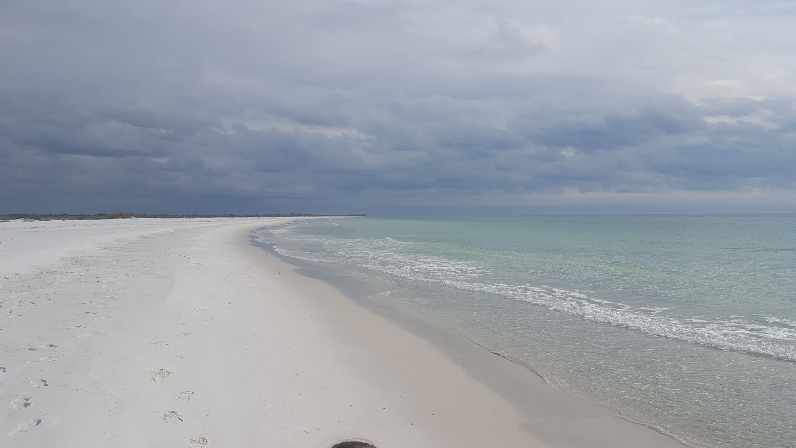 Fotografie cu Tyndall Beach cu o suprafață de nisip fin alb