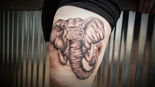 Explore front thigh tattoo ideas for women, creative tattoo ideas in Minocqua, available at Whisky Rose Tattoo Parlor