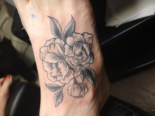 Explore tattoo ideas for football, creative tattoo ideas in Lexington, available at Tempest Tattoo Studio