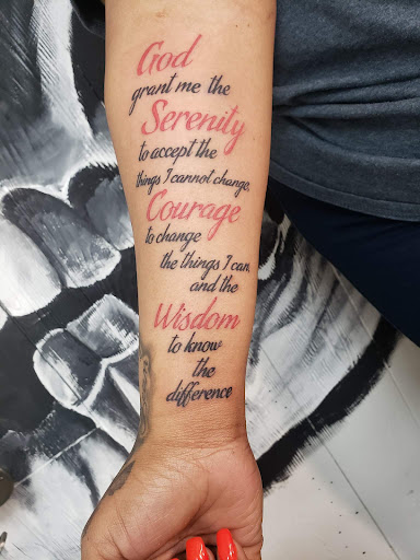 Explore tombstone movie tattoo ideas, creative tattoo ideas in Decatur, available at Exclusive Ink Tattoos & Body Piercings 22nd & Wood