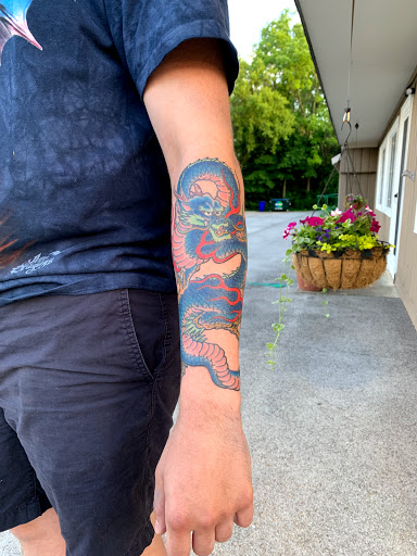 Explore lion and the lamb tattoo ideas, creative tattoo ideas in Warrenville, available at NoodlesTattoo Co. & Studio